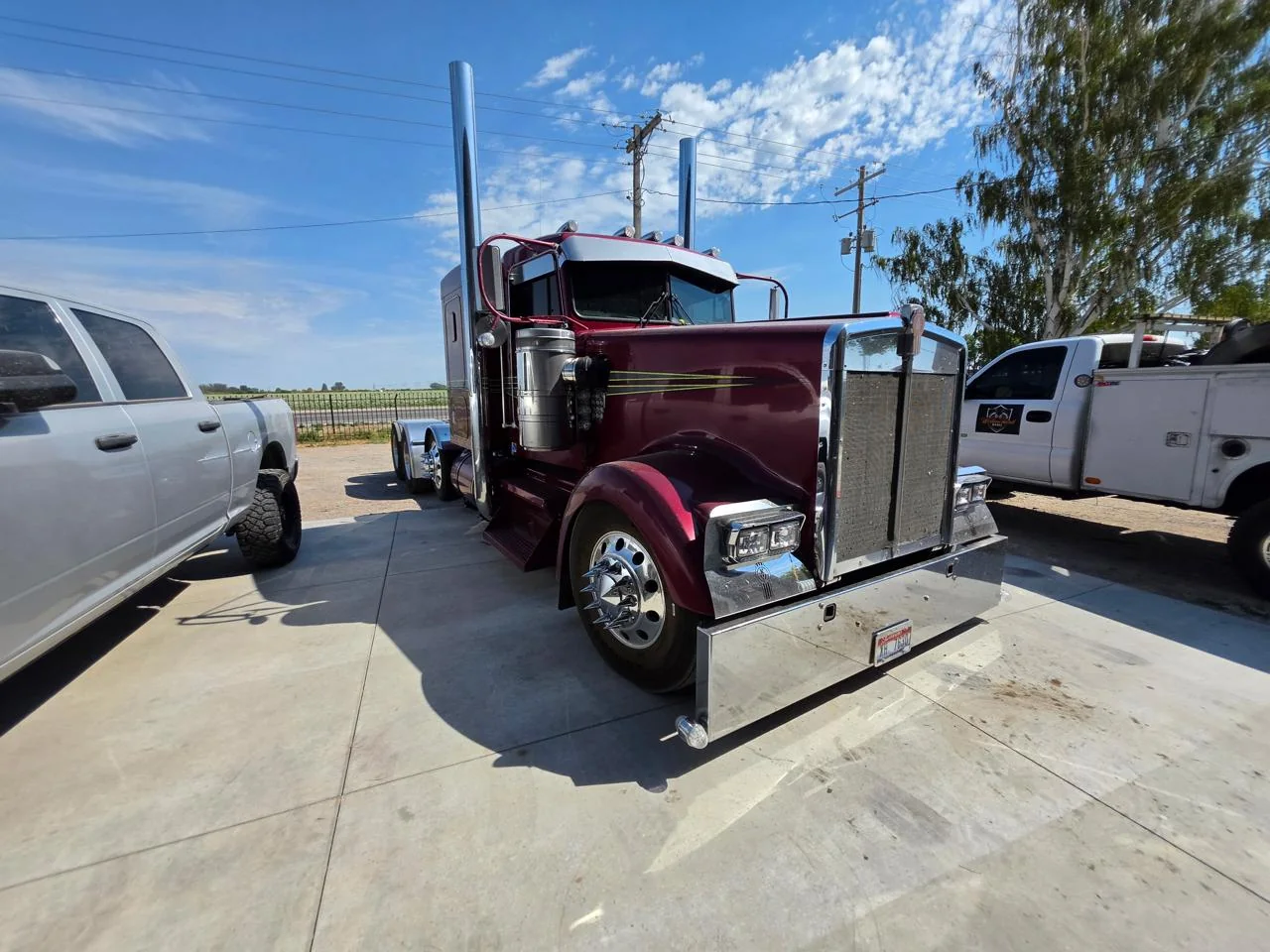 Burgundy Kenworth semi truck at Western Diesel Workz