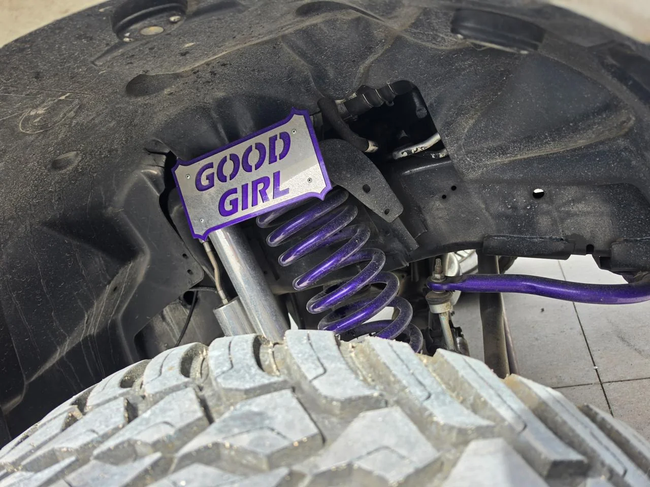 Purple pickup suspension spring and shock components